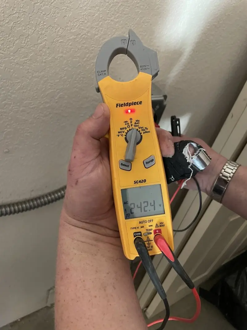 Voltage testing with clamp meter during Aluminum Wiring Replacement in The Village of Indian Hill